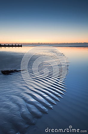 Beautiful low tide beach vibrant sunrise Stock Photo