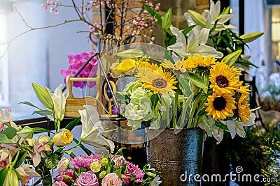 beautiful luxury bouquet. Mixed flowers on pink table. the work Stock Photo