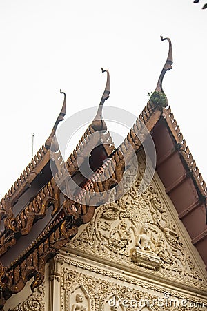 Beautiful magnificent ancient Thai isosceles and carving at Wat Anuphatkritdaram, Phuket Thailand Stock Photo