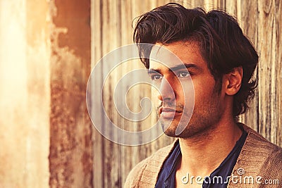 Beautiful man close portrait. Young and handsome Italian man with stylish hair Stock Photo