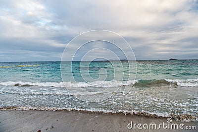 Beautiful marine. Blue sea on cloudy sky background. Sea waves on sandy beach. Sea shore. Seascape. Sea voyage. Summer Stock Photo