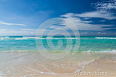 Beautiful marine view on caribbean sea coast line with clean wavy surf ocean water on sandy beach at sunny day Stock Photo
