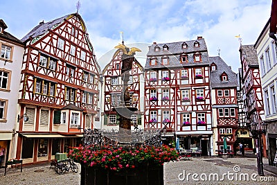 Market Square with fountain, flowers and half timbered buildings in Bernkastel Kues, Germany Editorial Stock Photo