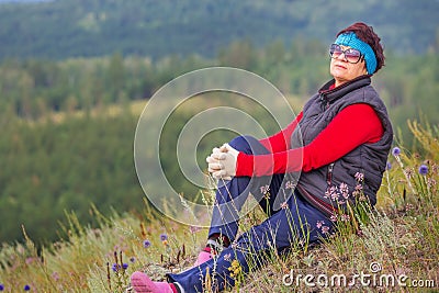 beautiful mature woman traveler enjoys the nature Stock Photo