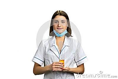 Beautiful medical dotor holding pills. Stock Photo