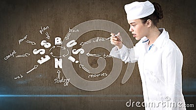 Beautiful medical woman doctor in uniform. Studio painted background. Concept of profitable health care. Stock Photo