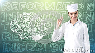 Beautiful medical woman doctor in uniform. Studio painted background. Concept of profitable health care. Stock Photo