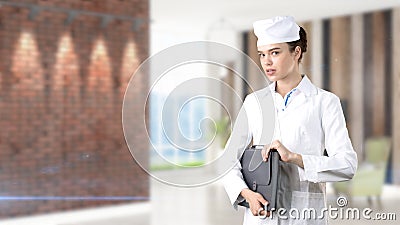 Beautiful medical woman doctor in uniform. Studio painted background. Concept of profitable health care. Stock Photo