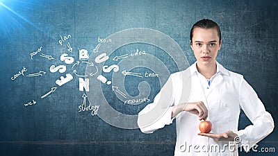 Beautiful medical woman doctor in uniform. Studio painted background. Concept of profitable health care. Stock Photo