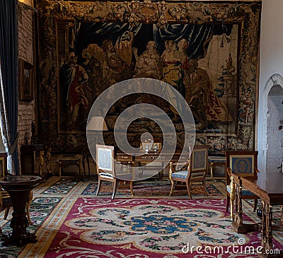 Beautiful medieval office room with wall art, chairs and tables of the old Bellver castle, Spain Editorial Stock Photo