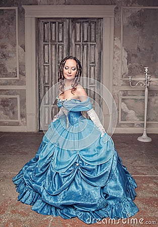 Beautiful medieval woman in blue dress Stock Photo