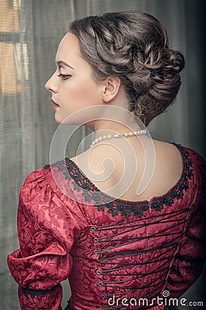 Beautiful medieval woman in red dress Stock Photo