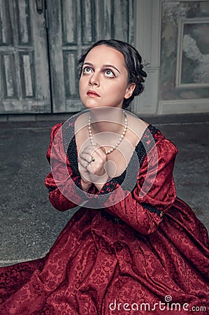 https://thumbs.dreamstime.com/x/beautiful-medieval-woman-red-dress-praying-young-long-old-room-45382508.jpg