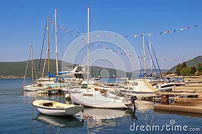 Sailboats and fishing boats on water. Montenegro, Bay of Kotor Stock Photo