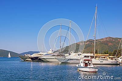 Beautiful Mediterranean landscape. Sailboats and fishing boats on water. Montenegro. View of Kotor Bay Stock Photo