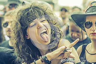 Metalhead girl in a metal concert Editorial Stock Photo