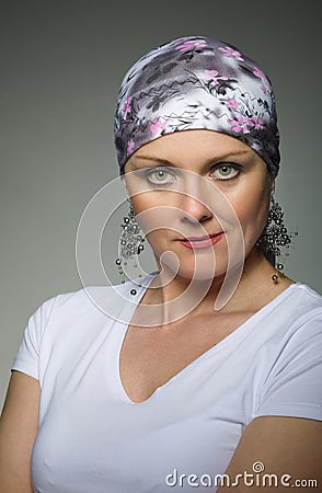 Beautiful middle age woman cancer patient wearing headscarf Stock Photo