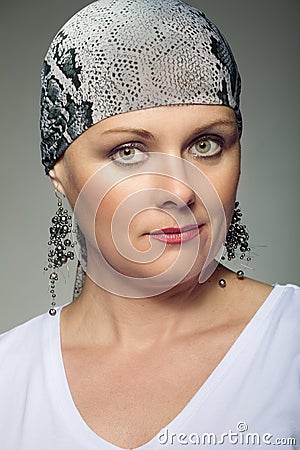 Beautiful middle age woman cancer patient wearing headscarf Stock Photo