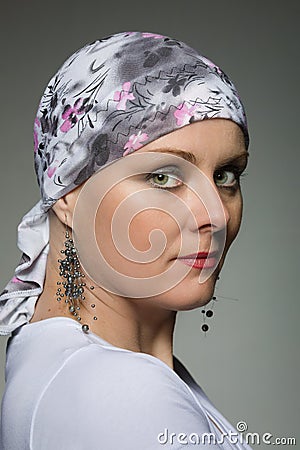 Beautiful middle age woman cancer patient wearing headscarf Stock Photo