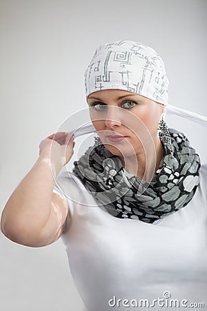 Beautiful middle age woman cancer patient wearing headscarf Stock Photo