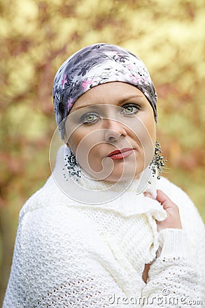 Beautiful middle age woman cancer patient wearing headscarf Stock Photo