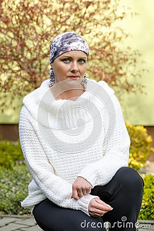 Beautiful middle age woman cancer patient wearing headscarf Stock Photo