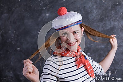 Beautiful midle aged lady having fun in sailor`s suit Stock Photo