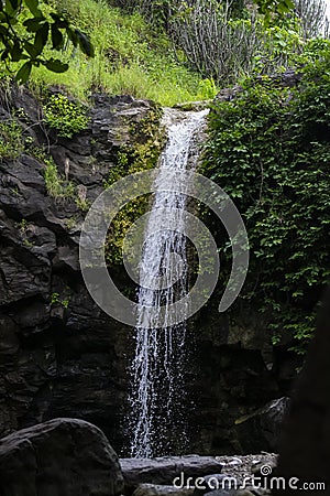 Beautiful Milky Waterfall and Surrounding Rocks with Trees in Forest of Central India Stock Photo