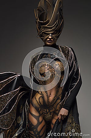 Beautiful model with fantasy golden butterfly body art Stock Photo