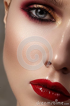 Beautiful model with fashion make-up. Close-up portrait woman with glamour lip gloss makeup Stock Photo