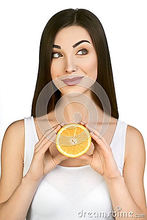 Beautiful Model Holding Half of Juicy Orange on White Background. Stock Photo