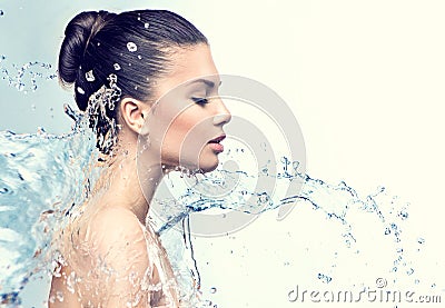Beautiful model woman with splashes of water Stock Photo