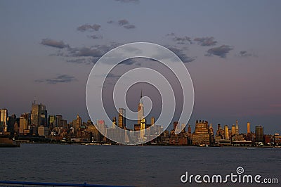 Beautiful modern city at the shore at sunset Editorial Stock Photo