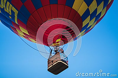 A colorful hot air balloon on a beautiful summerday with a blue sky. Editorial Stock Photo
