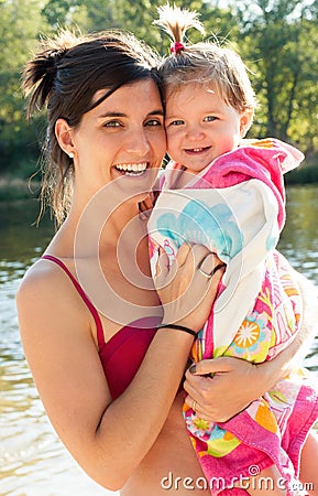 Beautiful mommy and baby after bathing in the river Stock Photo