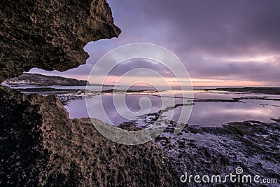 A beautiful moody and calm seascape taken at sunrise Stock Photo