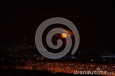 Beautiful moonrise on the background of factory pipes and the city of Novokuznetsk in Russia Stock Photo