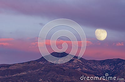 Beautiful Moonrise and Dusk Desert Sky Stock Photo