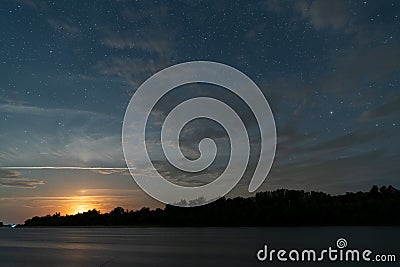 Beautiful moonrise and starry sky Stock Photo