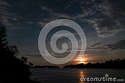 Beautiful moonrise and starry sky Stock Photo