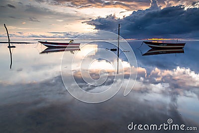 A small fishing boat boomed in the morning. Stock Photo