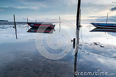 A small fishing boat boomed in the morning. Stock Photo