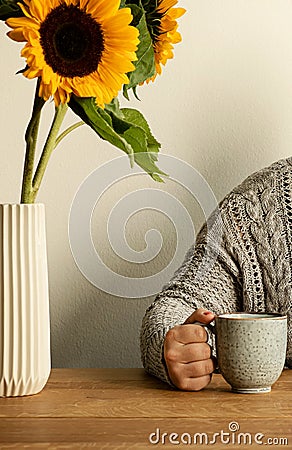 Beautiful morning with coffee and sunflowers on the wooden table Stock Photo