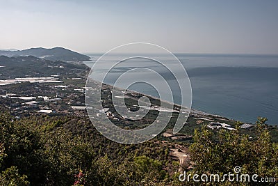 Beautiful morning sea coast with mountains Stock Photo