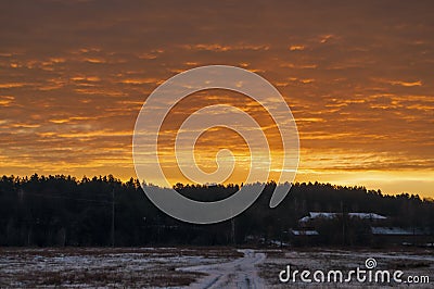 Beautiful morning and winter bright sunrise in January. Suburb and field covered snow Stock Photo