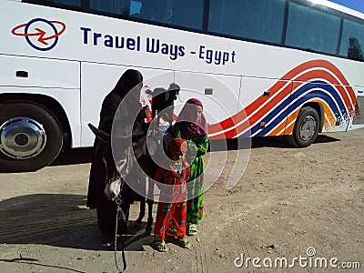 Beautiful mother Bedouin with two children with donkey on the way to Luxor, city in Egypt, Bedouin lifestyle Editorial Stock Photo