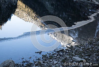 Beautiful mountain lake of artouste in sunrise dawn reflecting mountains, pyrenees, france Stock Photo