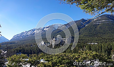 Beautiful mountain landscape surrounds the infamous Fairmont Banff Springs Hotel Editorial Stock Photo