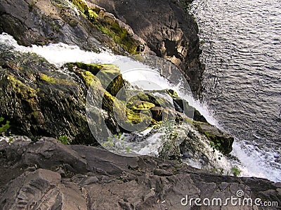 Mountain low waterfall with a rapid current Stock Photo