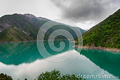 Beautiful mountain turquoise color lake Karasuu. Kyrgyzstan. Stock Photo